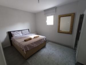 Llit o llits en una habitació de KULİS HOME OTTOMAN FAMİLY APARTMENTS