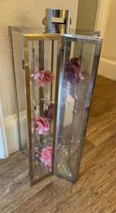 a glass vase filled with lots of pink flowers at Abbey House B & B in Penrith
