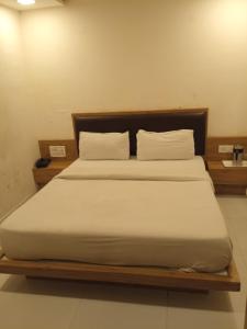 Postel nebo postele na pokoji v ubytování Hotel Maan Palace