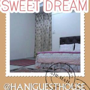 a poster of a bedroom with a bed in a room at Hani Guest House Big House in Melaka