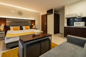 Posteľ alebo postele v izbe v ubytovaní Apartamenty Wakacyjna Wioska Ngô 20m od Suntago
