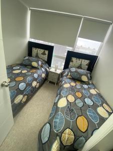 Postel nebo postele na pokoji v ubytování Bellísimo y centrico apartamento en La Serena