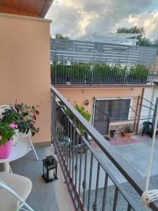 a balcony with a view of a building at Borghetto Verde in Locri