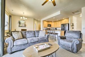 a living room with a couch and a table at Mesquite Desert Retreat Near Golf and Casinos! in Mesquite