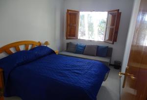 A bed or beds in a room at Pink Lake