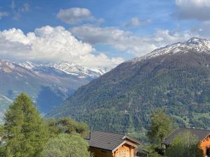 a view of a mountain range with snow covered mountains at Aiguilles Rouges - Tête Blanche - Thermes de la Dixence in Hérémence