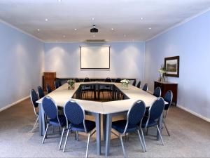 a conference room with a large table and chairs at Greyton Lodge in Greyton