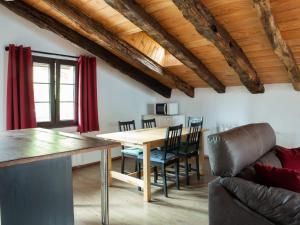 a kitchen and dining room with a table and chairs at Okana Baserria in Muxika