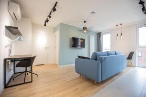 Televízia a/alebo spoločenská miestnosť v ubytovaní Rent40 Apartamenty Aura 2 Gdańsk Old Town