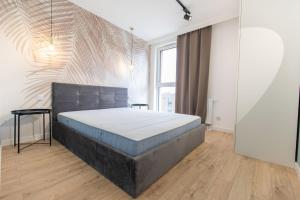 Posteľ alebo postele v izbe v ubytovaní Rent40 Apartamenty Aura 2 Gdańsk Old Town
