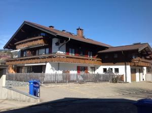a large building with a fence in front of it at Alpenflair Ferienwohnung 228 Söllereck in Oberstdorf