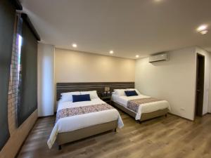 Postelja oz. postelje v sobi nastanitve EcoHub Hotel Medellin