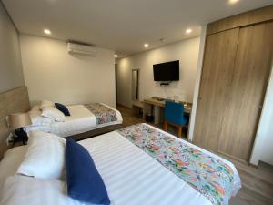 Postelja oz. postelje v sobi nastanitve EcoHub Hotel Medellin