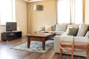 a living room with a couch and a coffee table at TopSleep Apartments 26-1 in Arnhem