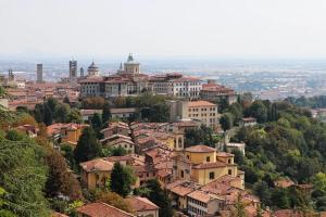 a view of a city with houses and buildings at Penthouse in Città Alta - Bergamo in Bergamo
