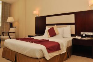 Postel nebo postele na pokoji v ubytování Harmony Hotel