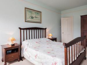 a bedroom with a bed and two night stands at Mount Boone 12a in Dartmouth