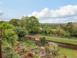 a train on the tracks in a field at Nantclwyd in Llangollen