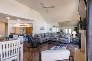 a living room with a couch and a kitchen at B 32-1 Spacious Villa Close to Pool in Branson
