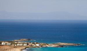an aerial view of an island in the ocean at Blue Beach Villas Apartments in Stavros