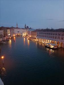 a view of a river with buildings and a city at Locanda Ai Santi Apostoli in Venice