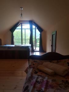 Postel nebo postele na pokoji v ubytování Guest House Sando