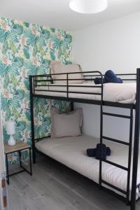 Posteľ alebo postele v izbe v ubytovaní Gîte Lou, Gîte famille et bien être avec jacuzzi