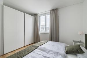 Ein Bett oder Betten in einem Zimmer der Unterkunft Traunseeresidenzen