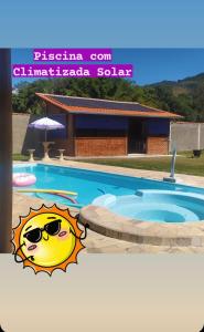 Bazén v ubytování Chácara das Primaveras nebo v jeho okolí