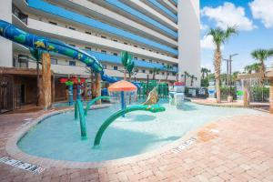 a pool with a water slide in a building at Oceanfront 3BR/2BA, Ocean Reef, Waterpark in Myrtle Beach