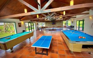 a large room with two ping pong tables at Estancia Turística San Pedro de Timote in Reboledo