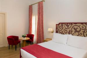Posteľ alebo postele v izbe v ubytovaní Casa Romana Hotel Boutique