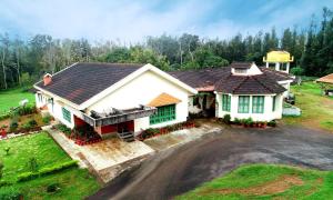 an aerial view of a house at Hill Top Homestay - Estate & Whole Place in Chikmagalūr