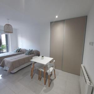 a living room with a couch and a table at PELLERANO APARTMENT in Adrogué