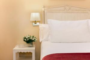 Posteľ alebo postele v izbe v ubytovaní Casa Romana Hotel Boutique