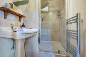 a bathroom with a sink and a shower at The Tea House in Rye