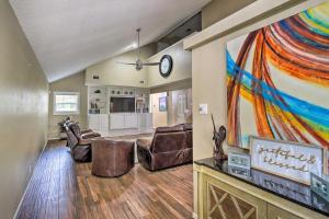 a living room with a large painting on the wall at Family Retreat about 1 Mi to Hill Country Mile! in Boerne