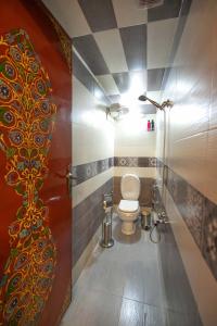 a bathroom with a toilet in a room at Dar Dahab in Fez