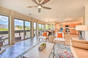 a living room with a ceiling fan at Patio and Panoramic Desert Views Sedona Getaway! in Sedona
