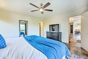 a bedroom with a bed and a ceiling fan at Patio & Panoramic Desert Views: Sedona Getaway! in Sedona