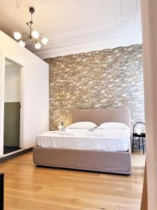 A bed or beds in a room at Pantheon Rome Relais