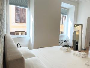 A bed or beds in a room at Pantheon Rome Relais