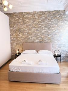 A bed or beds in a room at Pantheon Rome Relais