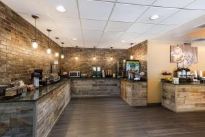 a fast food restaurant with wooden walls and a counter at Best Western Logan Inn in Chapmanville