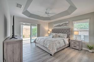 a bedroom with a bed and a ceiling fan at Swim in Pools and Play Golf Eleanor Villages Home in Wildwood