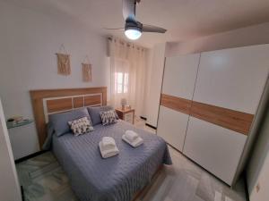 En eller flere senge i et værelse på Precioso apartamento cerca de Sierra Nevada