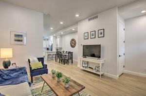a living room with a couch and a tv at Modern Mountain Escape Near Slopes, Lakes and Trails in Eden