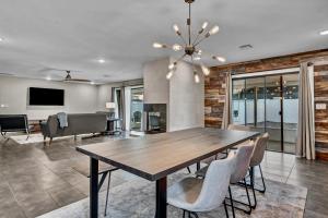 a dining room with a table and chairs at Quiet Contemporary Executive 4BD, 3BA Estate with Pool in Tempe