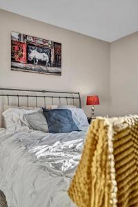 a bedroom with a bed and a picture of a horse on the wall at Quiet Contemporary Executive 4BD, 3BA Estate with Pool in Tempe