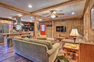 a living room with two couches and a kitchen at Hike On-Site Classic Cabin Nature Retreat in Glens